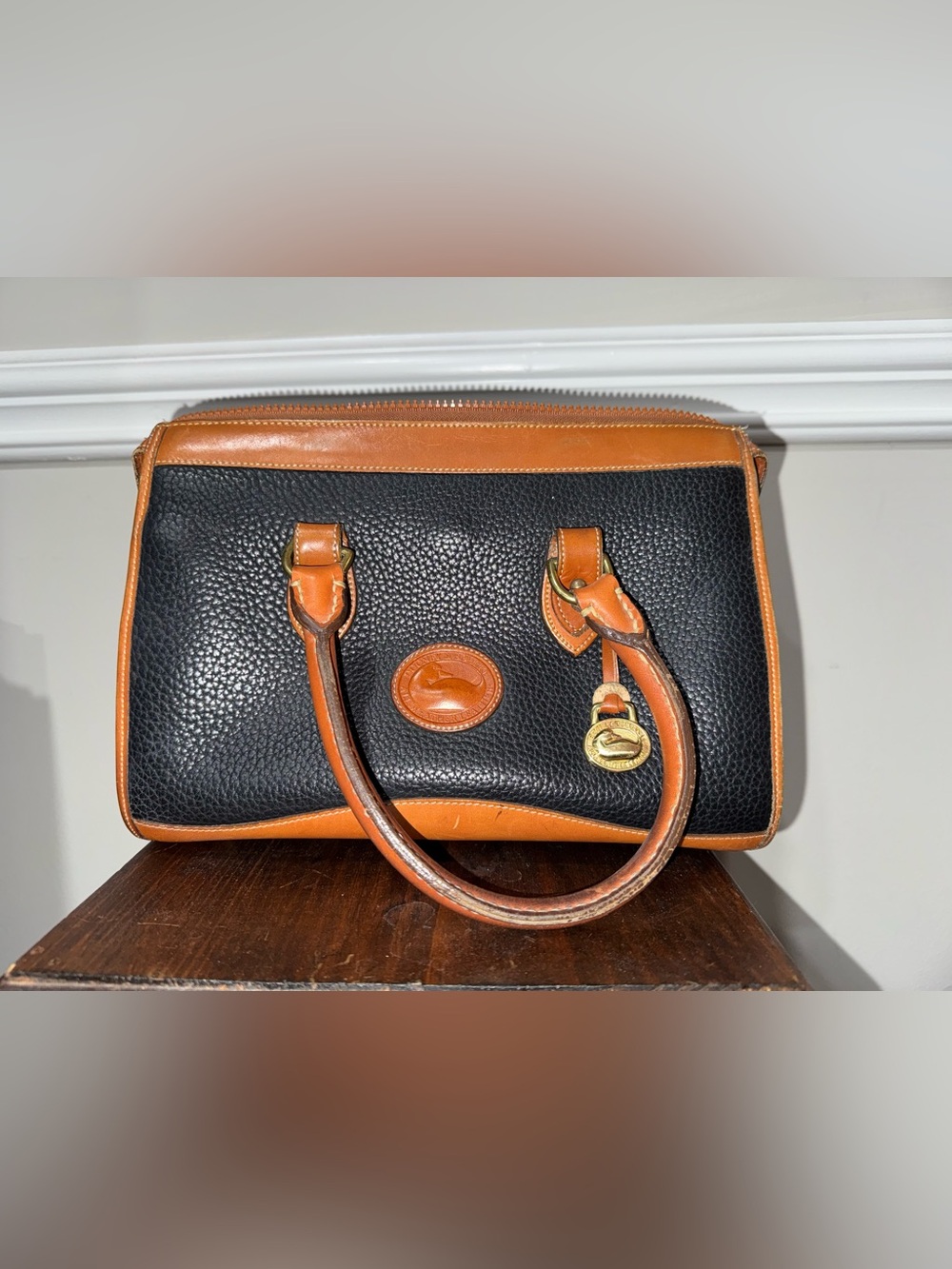 Dooney & Bourke Black Pebble Leather Satchel with Brown Trim